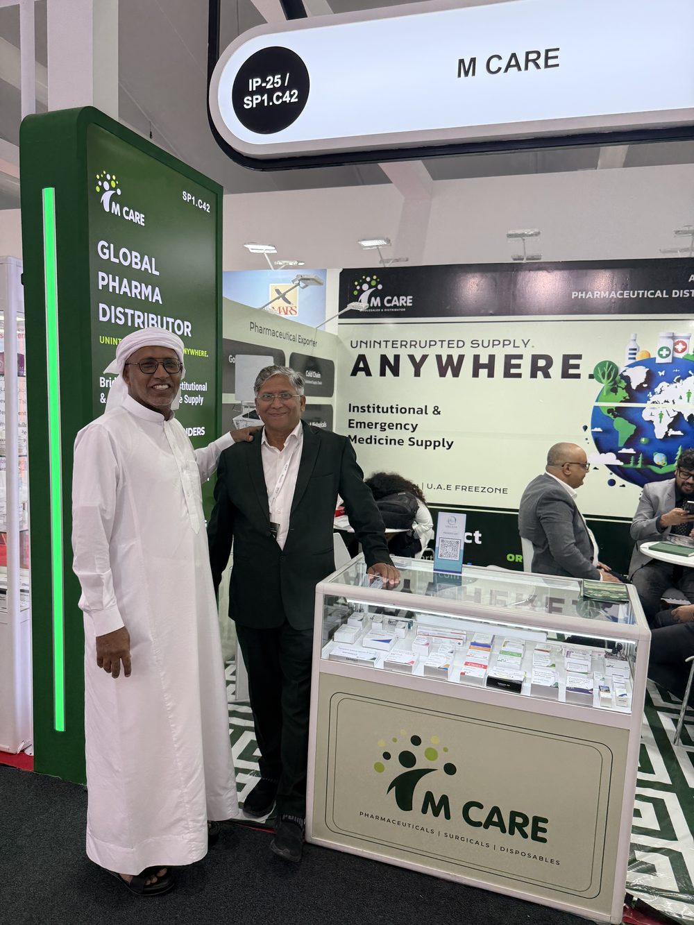 M Care booth at WHX Dubai 2026, "Uninterrupted Supply Anywhere" graphic with IP25 stand marker.
